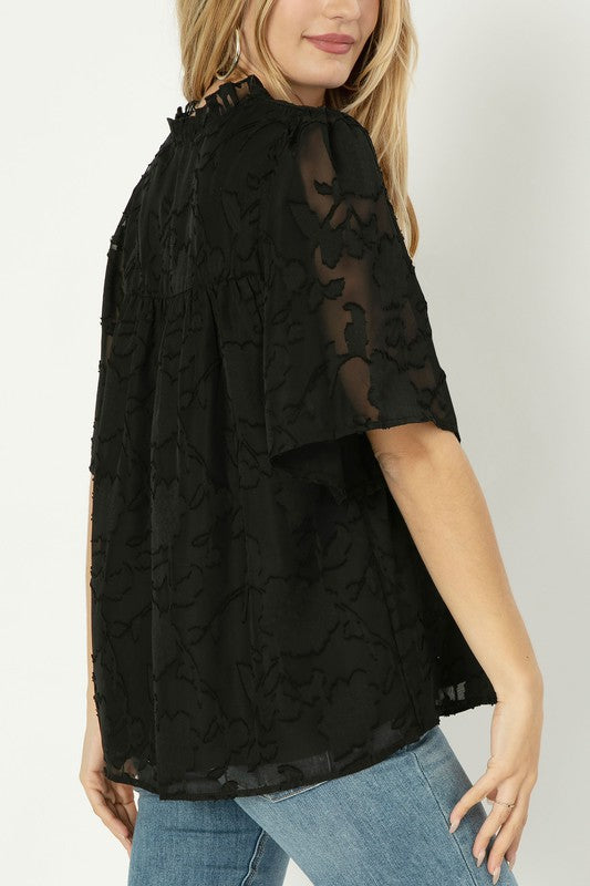 A line blouse with ruffle trim